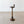 Load image into Gallery viewer, Antique Edwardian solid mahogany floor-standing smoker's stand featuring a dished gallery top with glass liner, matchbox sleeve, turned column, and stepped circular base.
