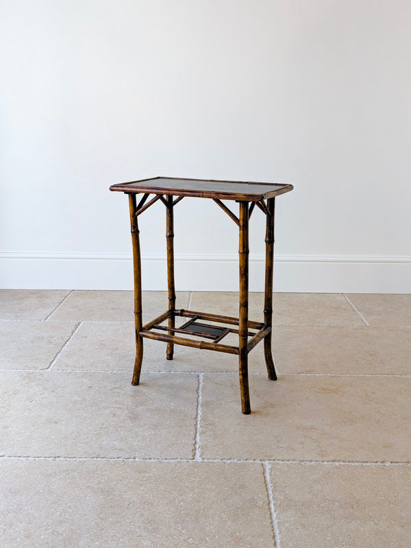 Antique Victorian bamboo occasional table with a hand painted japanned top, raised on straight gently flared legs united by a decorative stretcher arrangement.