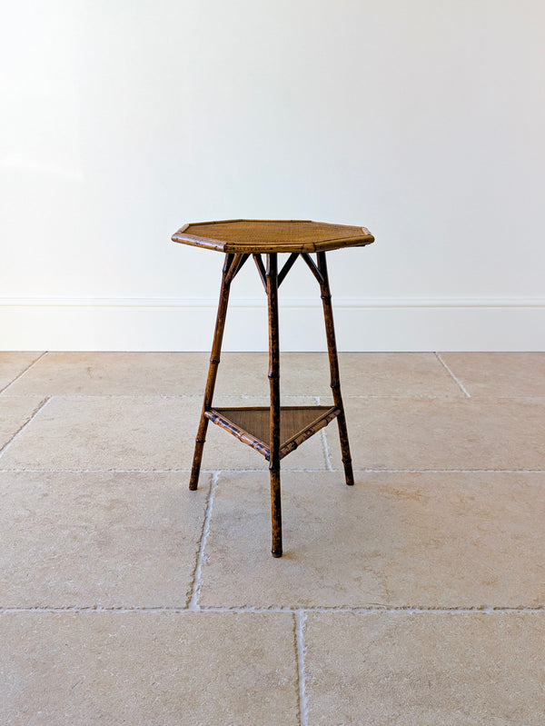 Antique Victorian bamboo octagonal occasional table with original woven surfaces, raised on straight gently flared legs united by a triangular lower tier.