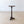 Load image into Gallery viewer, Antique Regency solid mahogany wine table featuring a dished top, turned baluster stem, and concave triform plinth raised on compressed bun feet.

