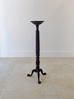 Antique Victorian Chippendale style mahogany torchère featuring a dished top, spiral-twist shaft, and fluted knop on acanthus-carved cabriole legs with ball-and-claw feet.