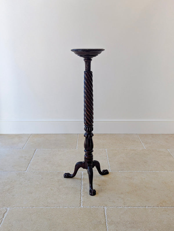Antique Victorian Chippendale style mahogany torchère featuring a dished top, spiral-twist shaft, and fluted knop on acanthus-carved cabriole legs with ball-and-claw feet.
