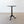 Load image into Gallery viewer, Antique Chippendale Revival solid mahogany tripod wine table with a removable circular top, fluted column, and acanthus-carved cabriole legs on carved feet.
