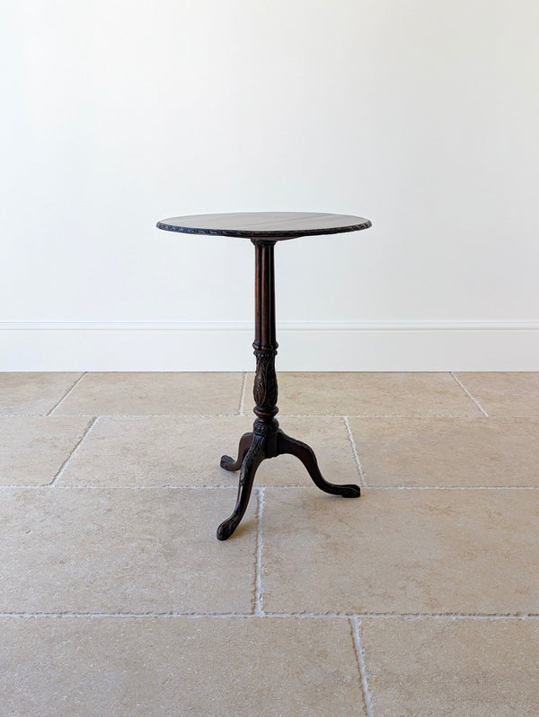 Antique Chippendale Revival solid mahogany tripod wine table with a removable circular top, fluted column, and acanthus-carved cabriole legs on carved feet.