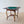 Load image into Gallery viewer, Antique Edwardian mahogany envelope card table featuring a quartered top, single frieze drawer, cabriole legs, shaped X-form stretcher, and brass and ceramic castors.
