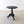 Load image into Gallery viewer, Antique Victorian Anglo-Indian ebonised hardwood occasional table with a carved circular top, turned baluster column, and carved tripod base on scroll feet.  
