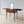 Load image into Gallery viewer, Antique George III mahogany gentleman's folding dressing table with hinged top leaves, fitted cosmetic interior, and square-tapered legs on brass cup castors.
