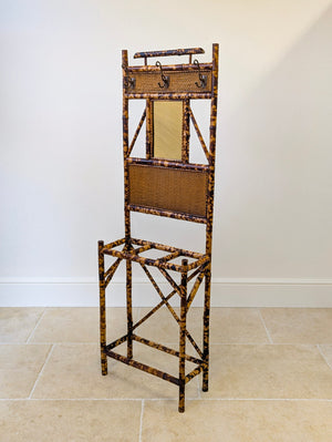 Aesthetic Movement bamboo hall stand with three coat hooks over a central mirror and lower stick stand.