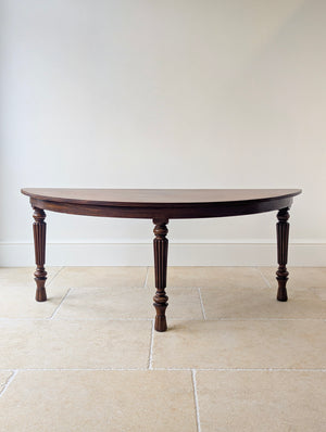 Antique Victorian Mahogany Console Table featuring a long solid D-end top, reeded edge, deep frieze, and three turned fluted legs with lobed feet.