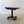 Load image into Gallery viewer, Antique William IV mahogany fold-over tea table featuring a boxwood-inlaid top, acanthus-carved pillar, and quadform platform base on gadrooned bun feet.
