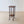 Load image into Gallery viewer, Antique Edwardian Arts and Crafts oak plant stand featuring a deeply carved square top, fixed undertier, and four slender square legs with splayed feet.
