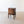 Load image into Gallery viewer, Antique George III mahogany cellaret featuring a hinged rectangular lid, an inlaid lozenge escutcheon, and boxwood stringing, raised on square tapered legs.
