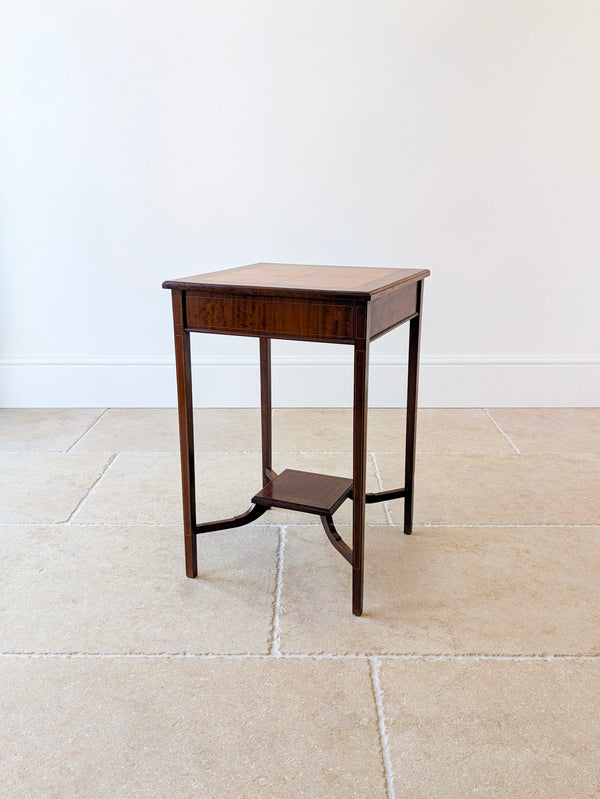Antique George III mahogany and burr yew occasional table with a bookmatched top, square tapering legs, and swept stretchers supporting an undertier.