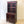 Load image into Gallery viewer, Antique George III mahogany cabinet bookcase with Gothic astragal glazed doors above a cupboard with flame mahogany oval reserves, raised on turned feet.

