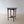 Load image into Gallery viewer, Antique Late Victorian Aesthetic Movement mahogany octagonal occasional table with a flame-figured top on ring-turned tapered legs united by an X-stretcher with turned finial.
