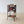 Load image into Gallery viewer, Antique Victorian bamboo canterbury magazine stand featuring hand-painted lacquer panels and a divided upper rack, raised on out-swept legs with brass foot caps.
