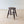 Load image into Gallery viewer, Antique Mid-Victorian solid English oak country low stool featuring a dished oval seat on raked tapered legs with incised ring collars and turned H-stretcher.
