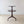 Load image into Gallery viewer, Antique Regency mahogany drop-leaf two-tier dumb waiter with twin graduated reeded platforms, turned central pillar, and reeded tripod legs on brass castors.
