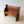 Load image into Gallery viewer, Antique Victorian Pitch Pine Pew featuring a panel back and single-plank seat with canted corners on chamfered solid slab standards.
