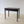 Load image into Gallery viewer, Antique Georgian oak side table featuring a heavily patinated three‑plank top and two frieze drawers with later neoclassical handles on tapered square legs.
