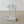 Load image into Gallery viewer, Antique late Victorian cast iron stick stand by Coalbrookdale with an arched Neoclassical cresting, openwork trellis back, and gadrooned plinth base with drip tray.
