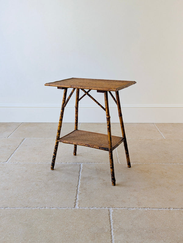 Antique late Victorian bamboo occasional table of rectangular form featuring a lower tier and cross braces, raised on gently splayed legs.