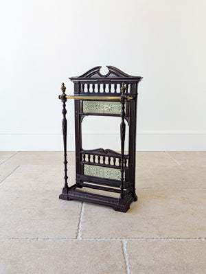 Antique Edwardian Aesthetic cast iron, brass and tiled hall stick stand featuring a Coalbrookdale cartouche, twin starburst tile friezes, and a stepped gadrooned base.