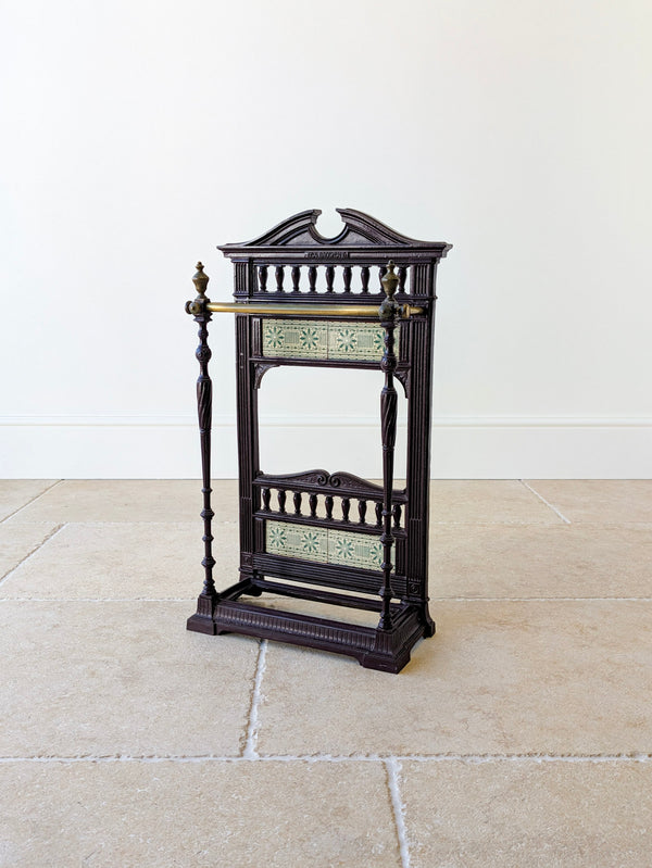 Antique Edwardian Aesthetic cast iron, brass and tiled hall stick stand featuring a Coalbrookdale cartouche, twin starburst tile friezes, and a stepped gadrooned base.