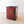 Load image into Gallery viewer, Antique Edwardian vulcanised fibre textile mill bin with solid hardwood rim, brass-lined handle, oxblood red panels, original decal, and riveted steel bindings.
