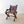 Load image into Gallery viewer, Antique Edwardian Gothic oak Glastonbury chair with a relief-carved IHS Christogram backboard, swept foliate arms, and solid seat, raised on an X-frame support.  
