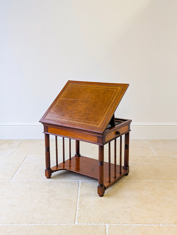 Antique Late Victorian mahogany library chairside reading table with an adjustable leather slope, twin lateral drawers, ring-turned legs, and square block feet.