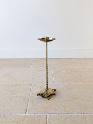 Antique early 20th century brass cigar stand with a dished tray featuring tortoises and acorn finial on a faux-bamboo column and tortoise base.