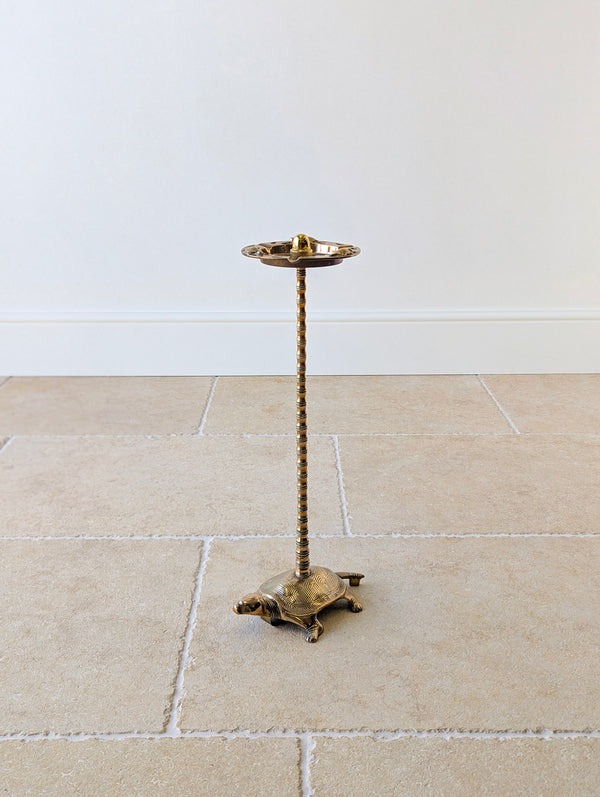 Antique early 20th century brass cigar stand with a dished tray featuring tortoises and acorn finial on a faux-bamboo column and tortoise base.