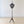 Load image into Gallery viewer, Antique George III mahogany tripod pole screen with an urn finial, shield-shaped frame housing a William Morris needlepoint panel, and down-swept legs.
