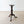 Load image into Gallery viewer, Antique Late Victorian mahogany tripod candle stand with a circular top, raised moulded border, fluted baluster stem, and sweeping cabriole legs on pad feet.
