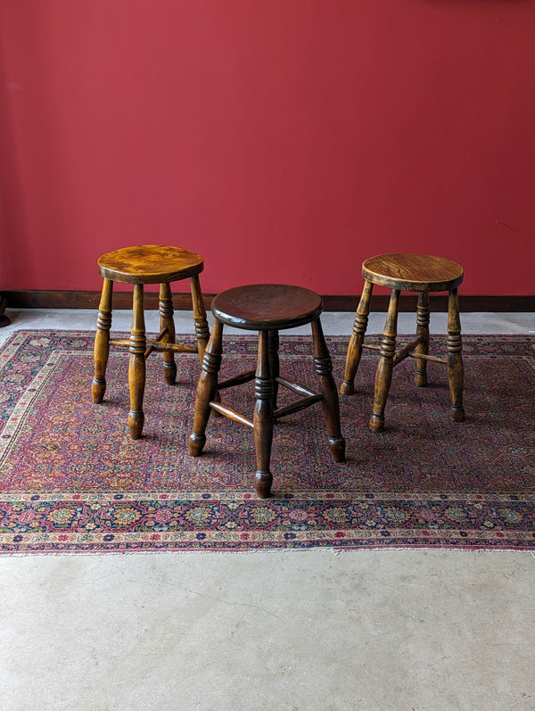 A Harlequin Set of Three Antique Early 20th Century Tavern Stools
