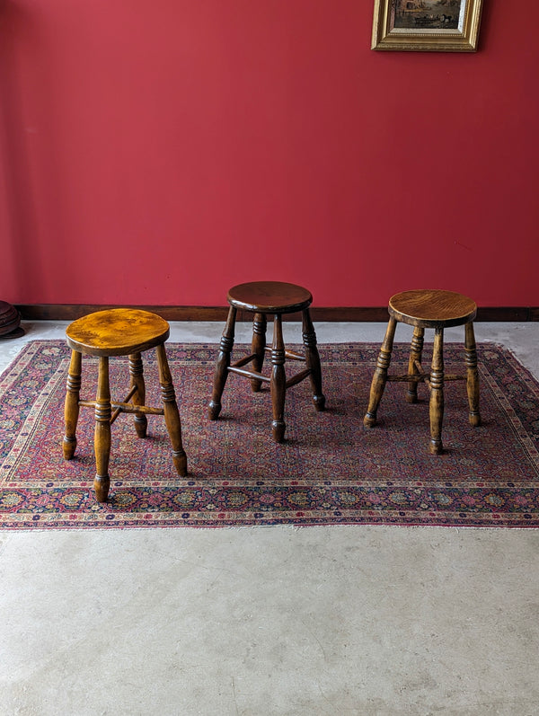 A Harlequin Set of Three Antique Early 20th Century Tavern Stools