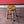 Load image into Gallery viewer, A Harlequin Set of Three Antique Early 20th Century Tavern Stools
